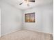 This bedroom features carpeted floors and a window offering neighborhood views at 640 W Country Estates Ave, Gilbert, AZ 85233