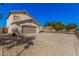 Charming two-story home featuring a tan stucco exterior, two-car garage, and low-maintenance desert landscaping at 640 W Country Estates Ave, Gilbert, AZ 85233