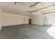 Spacious garage with epoxy floor and high ceiling at 640 W Country Estates Ave, Gilbert, AZ 85233