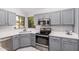 Updated kitchen features stainless steel appliances and plenty of cabinet space at 640 W Country Estates Ave, Gilbert, AZ 85233