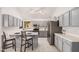 Modern kitchen features stainless steel appliances, a large island, and recessed lighting at 640 W Country Estates Ave, Gilbert, AZ 85233