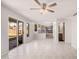 Spacious living room features tile floors, recessed lighting and access to kitchen and backyard at 640 W Country Estates Ave, Gilbert, AZ 85233