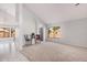 Bright living room with vaulted ceilings, neutral carpet, and tiled entryway at 640 W Country Estates Ave, Gilbert, AZ 85233