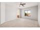 Spacious main bedroom features neutral walls, ceiling fan, carpeted floor and a window offering natural light at 640 W Country Estates Ave, Gilbert, AZ 85233