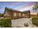 The backyard features low maintenance gravel landscaping and a covered patio for entertaining at 6936 E Snowdon St, Mesa, AZ 85207