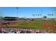 View of a baseball field in action with players and fans filling the stands at 7725 W Dreyfus Dr, Peoria, AZ 85381