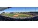 Full view of a baseball field, with spectators enjoying a game on a sunny day at 7725 W Dreyfus Dr, Peoria, AZ 85381