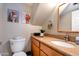 Cozy bathroom with a decorative mirror, granite countertop and charming wall art for a warm atmosphere at 7725 W Dreyfus Dr, Peoria, AZ 85381