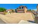 Charming two-story home with desert landscaping and a long private driveway to the attached two car garage at 7725 W Dreyfus Dr, Peoria, AZ 85381