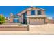 Charming two-story home with a well-maintained front yard and attached two-car garage at 7725 W Dreyfus Dr, Peoria, AZ 85381