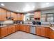 Bright kitchen equipped with stainless steel appliances, countertop seating, and generous cabinet space at 7725 W Dreyfus Dr, Peoria, AZ 85381
