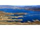 Picturesque lake view featuring a vast body of blue water, islands, and distant mountains at 7725 W Dreyfus Dr, Peoria, AZ 85381