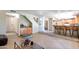 Cozy living room boasts tile floors, wet bar area, and bar seating to kitchen at 7725 W Dreyfus Dr, Peoria, AZ 85381