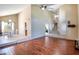 Bright living room boasts hardwood floors, high ceilings, and stairs to the second story at 7725 W Dreyfus Dr, Peoria, AZ 85381