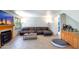 Comfortable living room area with fireplace, tv, wet bar, and tile flooring at 7725 W Dreyfus Dr, Peoria, AZ 85381
