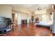 Spacious main bedroom with vaulted ceilings, wood floors, and a dedicated desk work area at 7725 W Dreyfus Dr, Peoria, AZ 85381