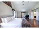 Spacious main bedroom featuring wood floors and multiple windows for ample natural light at 7725 W Dreyfus Dr, Peoria, AZ 85381