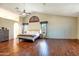Spacious main bedroom with vaulted ceilings, wood floors, and windows letting in the natural light at 7725 W Dreyfus Dr, Peoria, AZ 85381