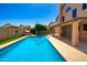 Relaxing backyard pool and covered patio area is ideal for entertaining and enjoying the sunny weather at 7725 W Dreyfus Dr, Peoria, AZ 85381