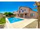 Backyard features a pool, patio and desert landscaping for outdoor enjoyment and relaxing by the water at 7725 W Dreyfus Dr, Peoria, AZ 85381