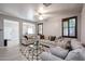 Cozy living room with plush seating, patterned rug, and natural light at 813 E Agua Fria Ln, Avondale, AZ 85323