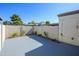 The backyard patio is a blank slate with painted surface and privacy block fence ready for customization at 8341 E Keim Dr, Scottsdale, AZ 85250