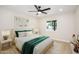 Inviting bedroom with a plush bed, soft lighting from bedside lamps, and an airy feel with natural light at 8341 E Keim Dr, Scottsdale, AZ 85250