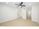 Spacious bedroom with wood flooring, closet, and a ceiling fan at 8341 E Keim Dr, Scottsdale, AZ 85250