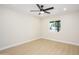Bright bedroom with wood flooring and a ceiling fan at 8341 E Keim Dr, Scottsdale, AZ 85250