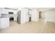 Spacious, renovated kitchen with stainless appliances, custom cabinets, and large format tile floors at 8341 E Keim Dr, Scottsdale, AZ 85250