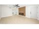 Open concept living room features custom slat wall, electric fireplace, and hardwood flooring at 8341 E Keim Dr, Scottsdale, AZ 85250