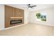 Bright living room featuring custom slat wall, electric fireplace, and new flooring at 8341 E Keim Dr, Scottsdale, AZ 85250
