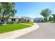 Charming neighborhood street showcases well-manicured lawns and diverse home styles, creating a welcoming community atmosphere at 8341 E Keim Dr, Scottsdale, AZ 85250