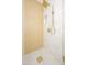Modern shower with gold hardware, square drain, and white tile at 8341 E Keim Dr, Scottsdale, AZ 85250