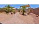 Landscaped backyard features a brick pathway, desert landscaping and hammock at 878 E Mountain View Rd, San Tan Valley, AZ 85143