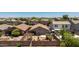 An aerial view of the backyard shows a patio area with an outdoor lounge and desert landscaping at 878 E Mountain View Rd, San Tan Valley, AZ 85143