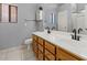 Bathroom with a double vanity, toilet, and framed mirror at 878 E Mountain View Rd, San Tan Valley, AZ 85143