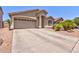 Attractive single-story home featuring a spacious driveway and well-maintained landscaping at 878 E Mountain View Rd, San Tan Valley, AZ 85143