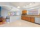 Well-lit kitchen area with wood cabinets, granite counters, tile backsplash and stainless appliances at 878 E Mountain View Rd, San Tan Valley, AZ 85143