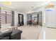Spacious, inviting living room with open floor plan, tile entry, and bright natural light at 878 E Mountain View Rd, San Tan Valley, AZ 85143