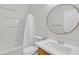 Neutral bathroom features a tub and sink with modern fixtures at 9261 W Sheridan St, Phoenix, AZ 85037