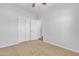 Bright bedroom featuring neutral carpet and large closet at 9261 W Sheridan St, Phoenix, AZ 85037