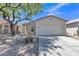 Attractive single-Gathering home featuring a two-car garage and desert landscaping at 9261 W Sheridan St, Phoenix, AZ 85037