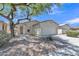 Charming single-story home with a well-manicured front yard and a mature shade tree at 9261 W Sheridan St, Phoenix, AZ 85037