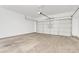 Spacious two car garage with an automatic overhead door at 9261 W Sheridan St, Phoenix, AZ 85037