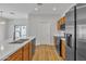 Bright kitchen featuring a kitchen island and stainless steel appliances at 9261 W Sheridan St, Phoenix, AZ 85037