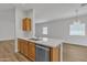 Modern kitchen featuring sleek countertops, stainless steel appliances, and an open layout at 9261 W Sheridan St, Phoenix, AZ 85037