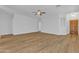 Bright, open-concept living space with wood-look floors and neutral paint at 9261 W Sheridan St, Phoenix, AZ 85037