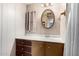 Bathroom vanity featuring a mirror, wallpaper and a sink at 9347 E Edgewood Ave, Mesa, AZ 85208