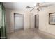 Bedroom featuring carpet flooring, ceiling fan and closet space at 9347 E Edgewood Ave, Mesa, AZ 85208